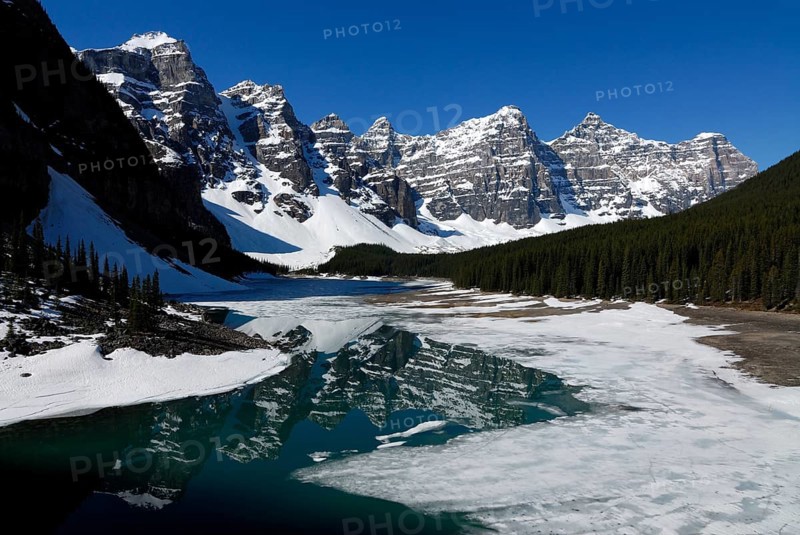 Wenkchemna Peaks mountain group reflected in the glacial Moraine Lake