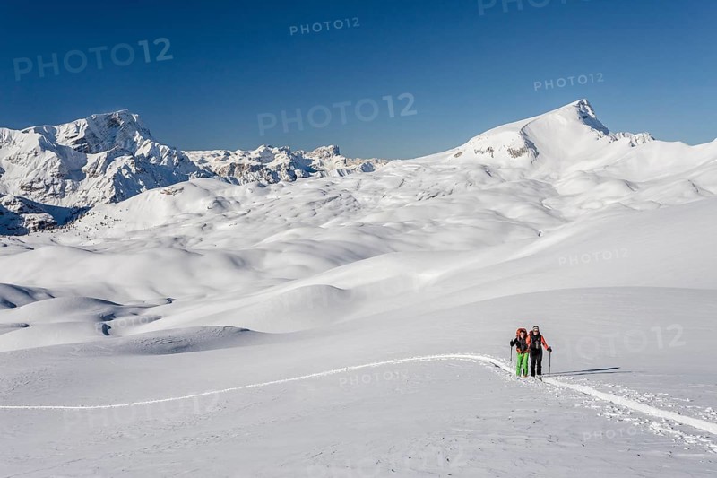 Ski mountaineers during the ascent of Mt Seekofel in the Fanes-Sennes-Prags Nature Park of the Dolomites