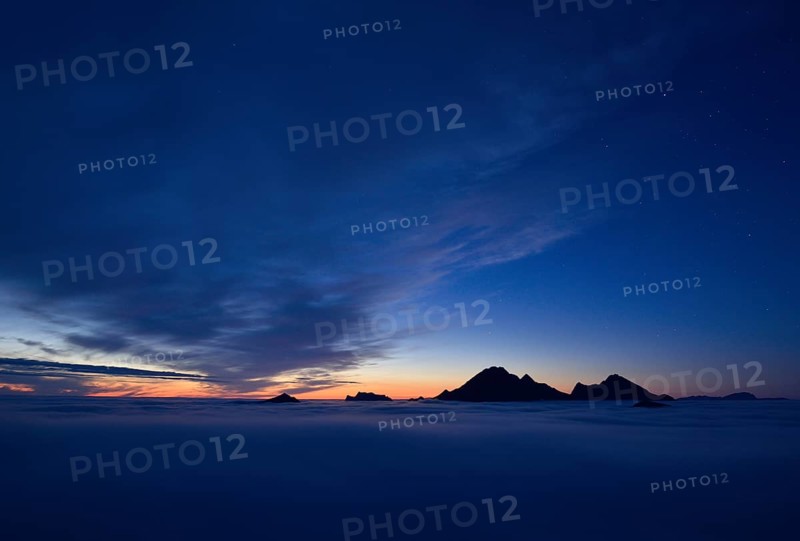 Clouds and mountain peaks