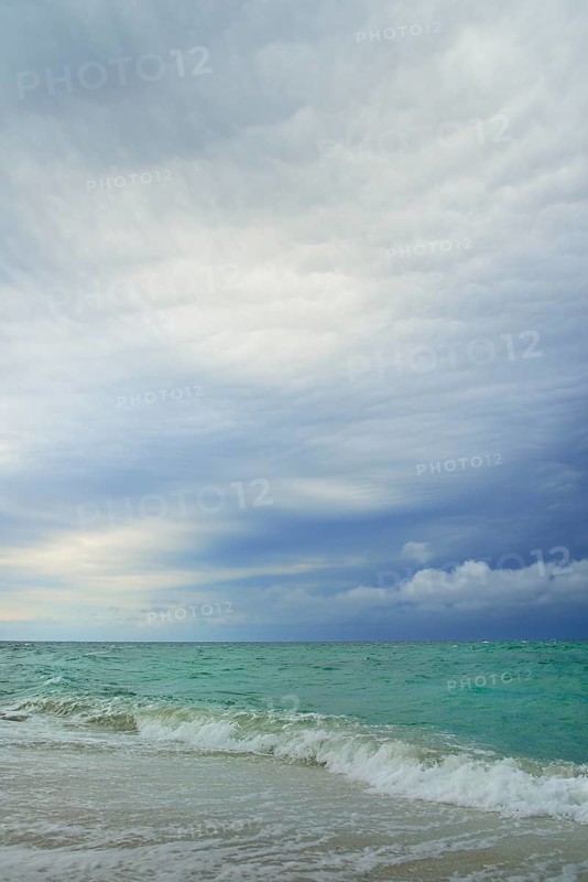 Storm clouds over the choppy sea