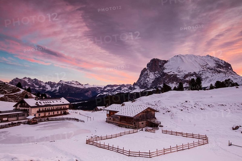 Dawn on Plattkofel and Mahlknechthutte hut in winter
