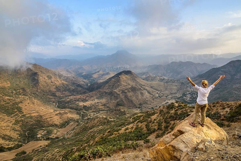 Woman enjoying the view over the mountains along the road from Massawa to Asmarra