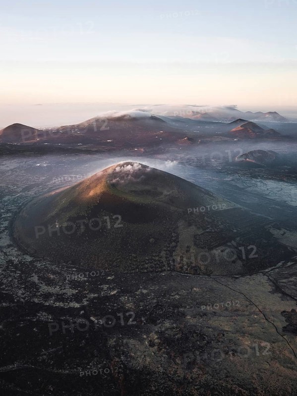 Volcanic crater with clouds