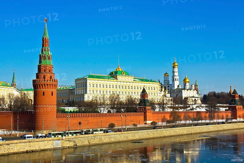 Moscow Kremlin with palace and cathedrals on bank of Moskva River with reflections