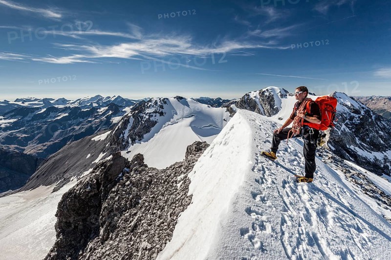 Mountaineer on the summit ridge of the Tuckettspitze on Stelvio Pass