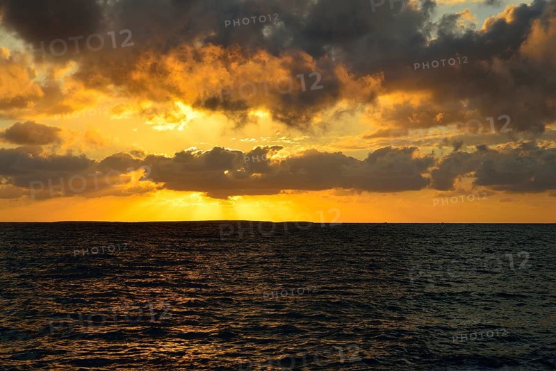 Sunset at sea with clouds