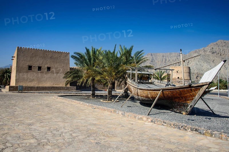 Old dhow in front of Khasab fort