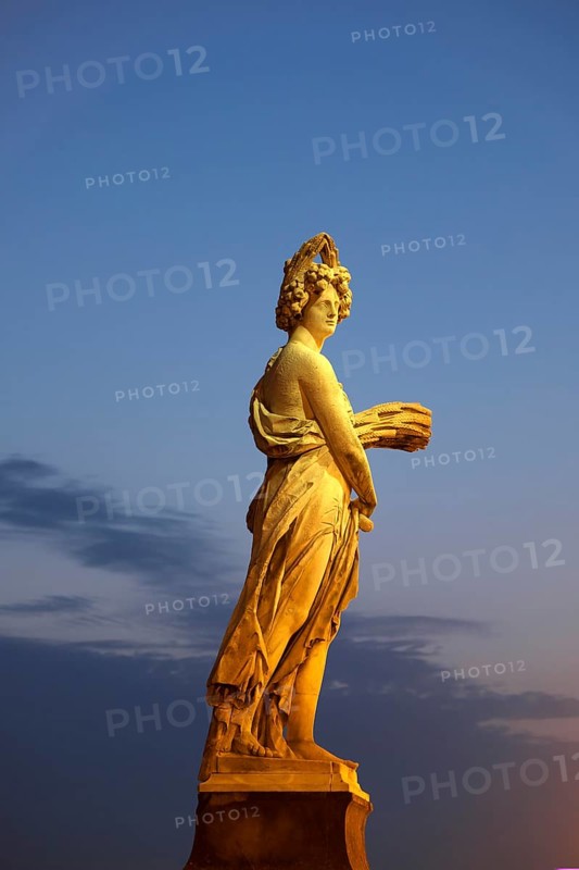Seasons statue on Ponte Santa Trinita bridge spanning the river Arno