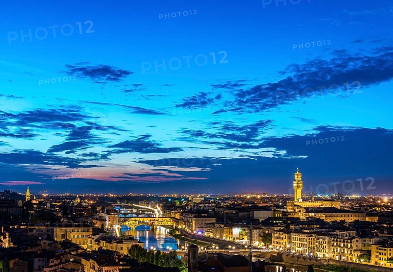 Illuminated city panorama at dusk with Florence Cathedral