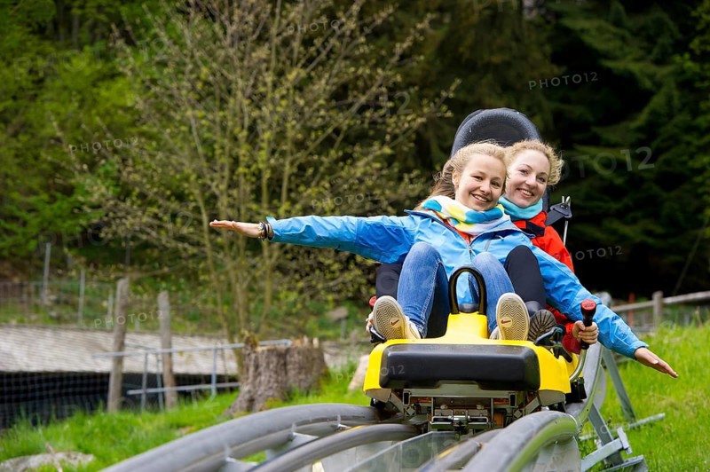 Young women on a summer toboggan run