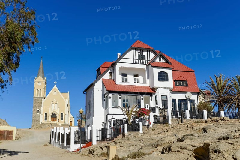 Half-timbered house from German colonial times and rock church in the old town of Luderitz