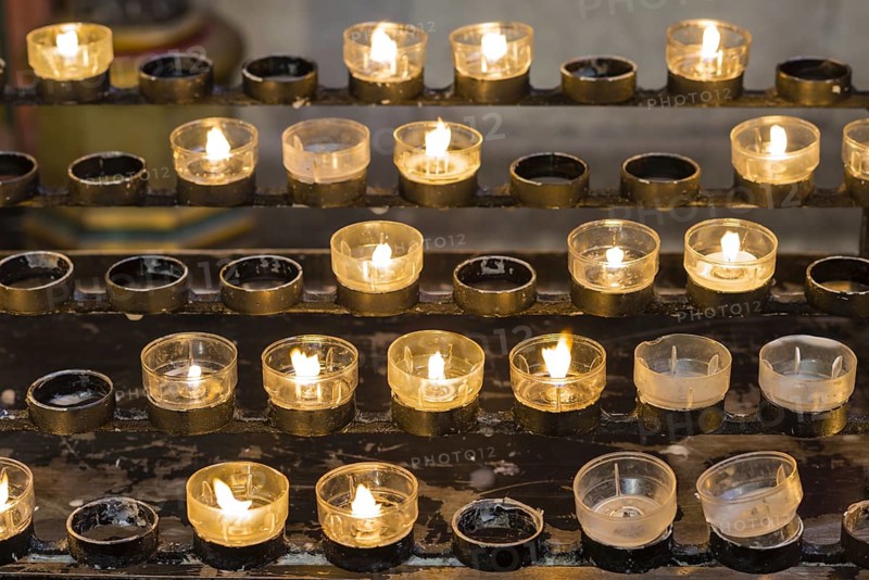 Lighted votive candles in a church