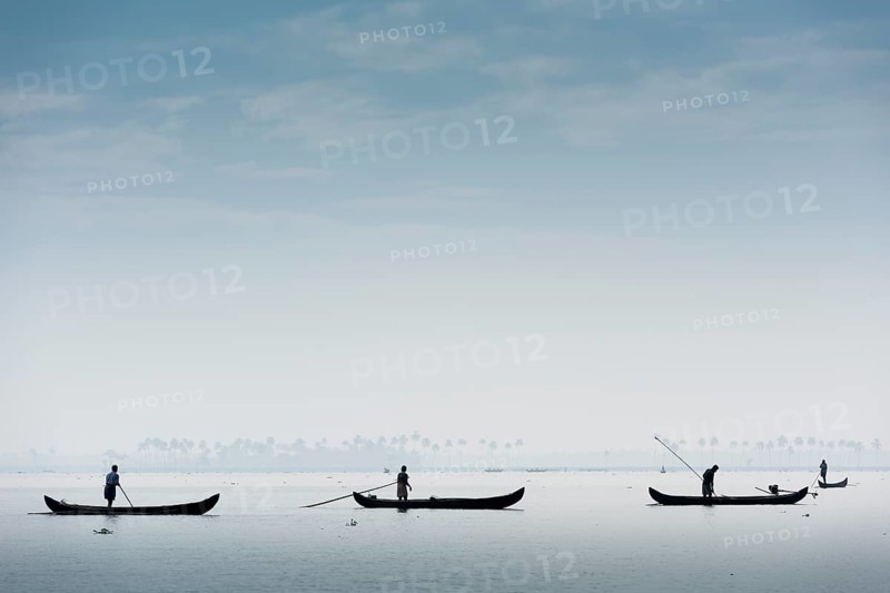 Cockle pickers with their boats