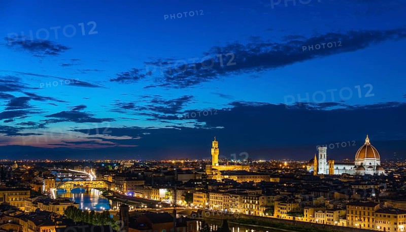 Illuminated city panorama at dusk with Florence Cathedral