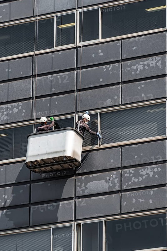 Two window cleaners at a skyscraper