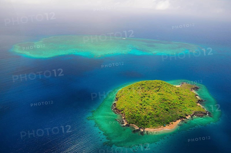 Uninhabited island with coral reef