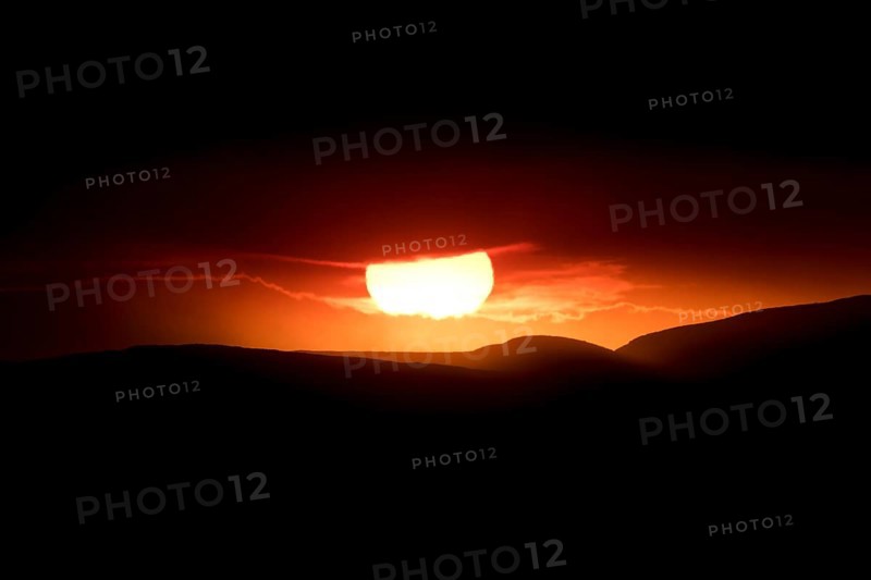 Sunset behind the ash and gas cloud of the Holuhraun fissure eruption