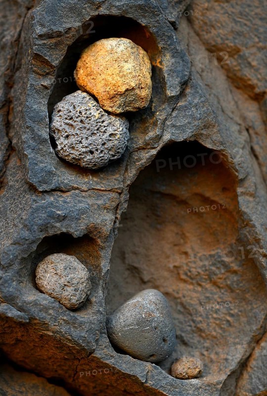Stone deposit on rock face