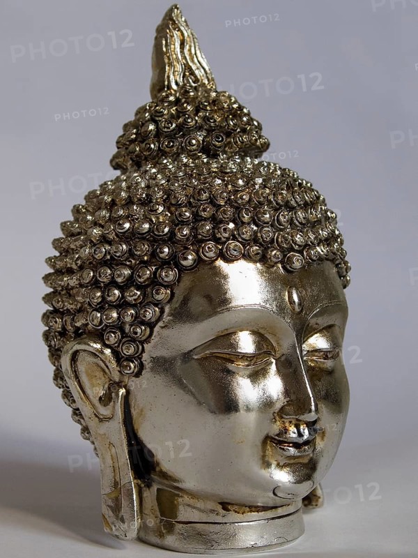 Silver head of a Buddha with eyes closed