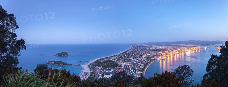 Panoramic view of the town of Mount Maunganui and the Port of Tauranga at nightfall