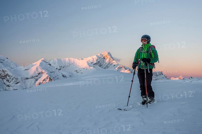 Ski tourer on the summit of Mt Col de Lasta in the Fanes-Sennes-Prags Nature Park in the Dolomites