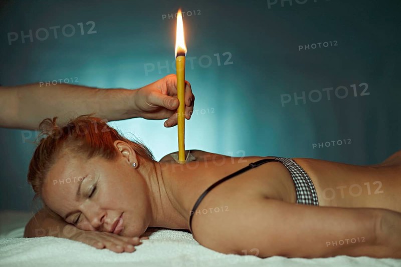 Woman being treated with a body candle