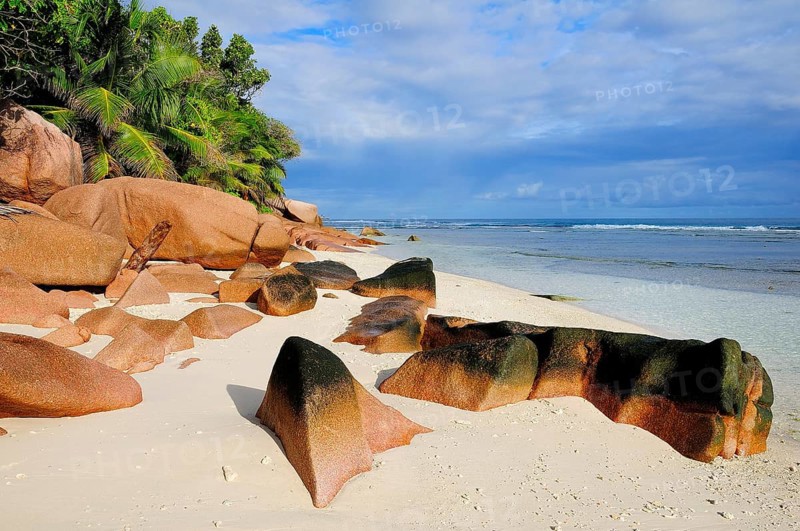 Granite rocks on the sandy beach beach