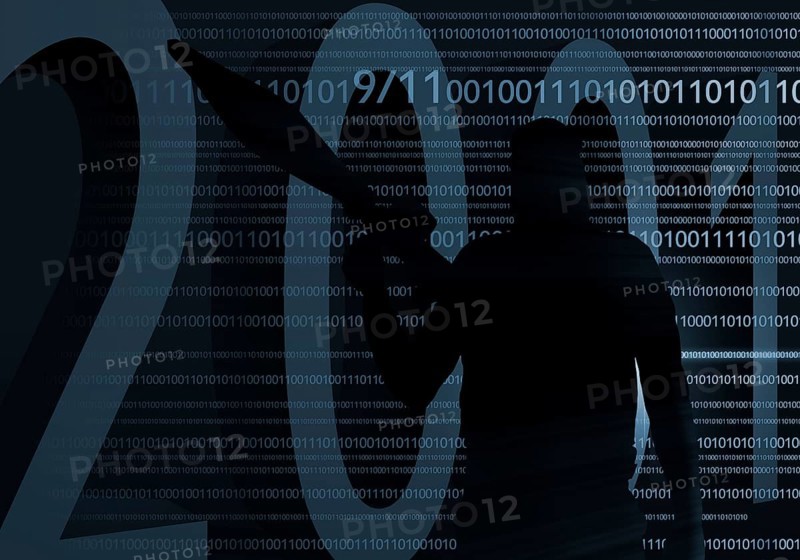 Terrorist in front of digital code