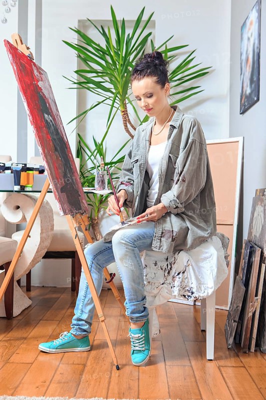Portrait of a female painter at work