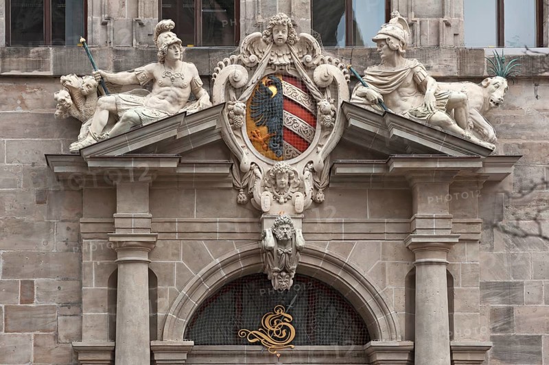 Right portal of the west facade with imperial coat of arms and the many-headed