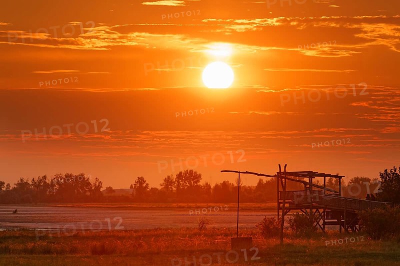 Drawing well at sunrise