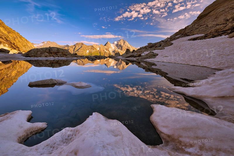 Reflection of the Oberalpstock in a mountain lake