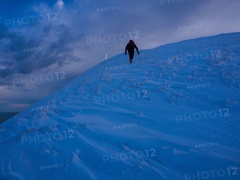 Hiker in snow on Monte Catria