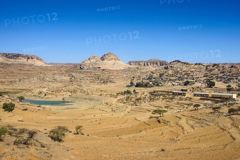 Mountain landscape along the road from Asmarra to Qohaito with a little pond