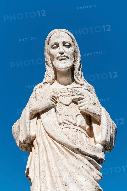 White statue of Jesus Christ outside the Chapel of Virgen de la Pena
