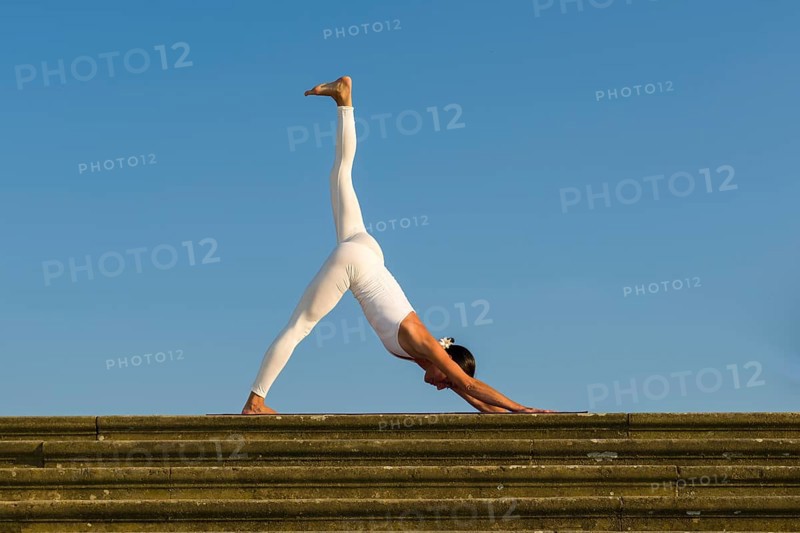 Young woman practising Hatha yoga