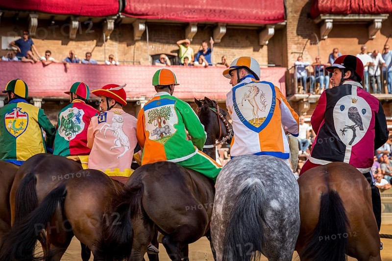 Jockeys from six different districts waiting for the start of Palio di Siena horse race on Piazza del Campo