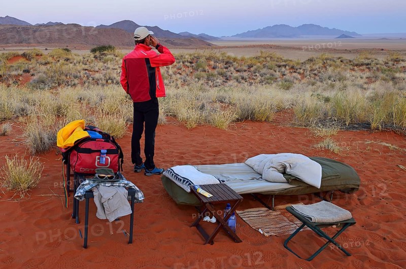 Tourist standing in an open air campsite at Schafberg Camp on Tok Tokkie Trail