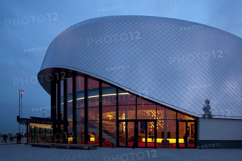 Stage Theater an der Elbe at dusk with illuminated hall