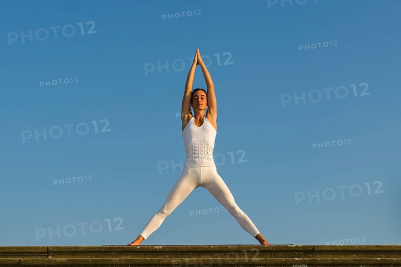 Young woman practising Hatha yoga