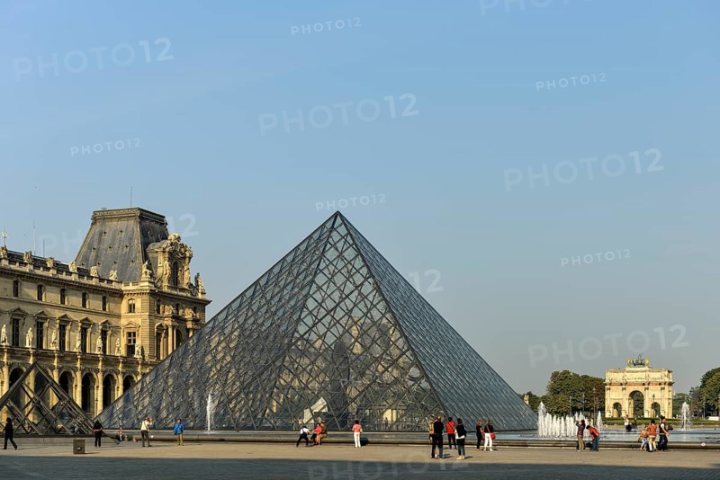 Glass pyramid in the courtyard of the Palais du Louvre and Arc de Triomphe du Carrousel