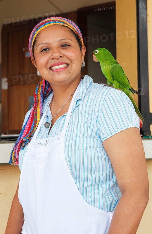 Woman with a parrot on her shoulder