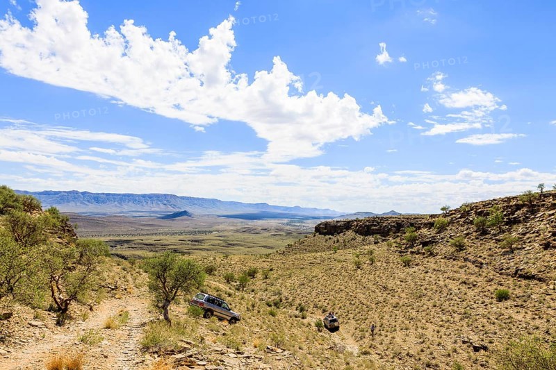 SUV driving through arid landscape