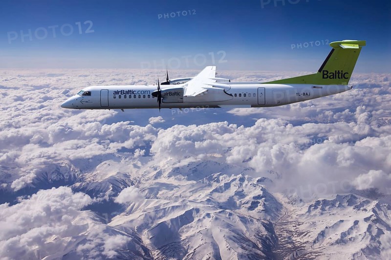 Aircraft YL-BAJ Air Baltic De Havilland Dash 8 in flight above the Alps