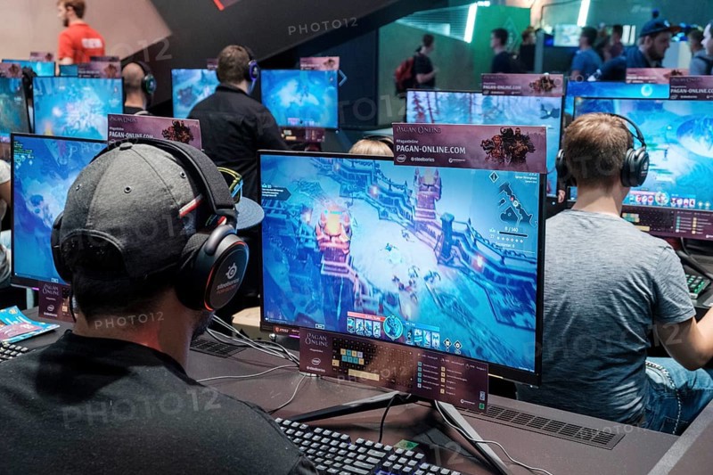 Visitors play video games at Gamescom