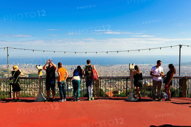 Tourists overlooking the city from Tibidabo Amusement Park
