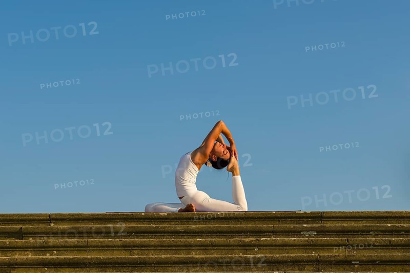 Young woman practising Hatha yoga
