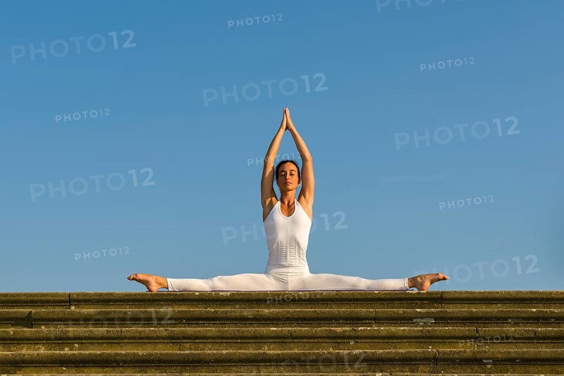 Young woman practising Hatha yoga