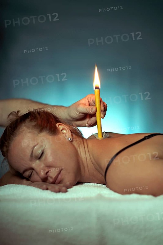 Woman being treated with a body candle
