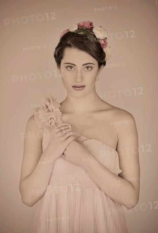 Beauty portrait of a young woman with flowers in her hair
